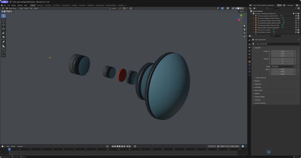 Blender viewport showing the internal lens groups, red filter and trial light source separated along the optical axis