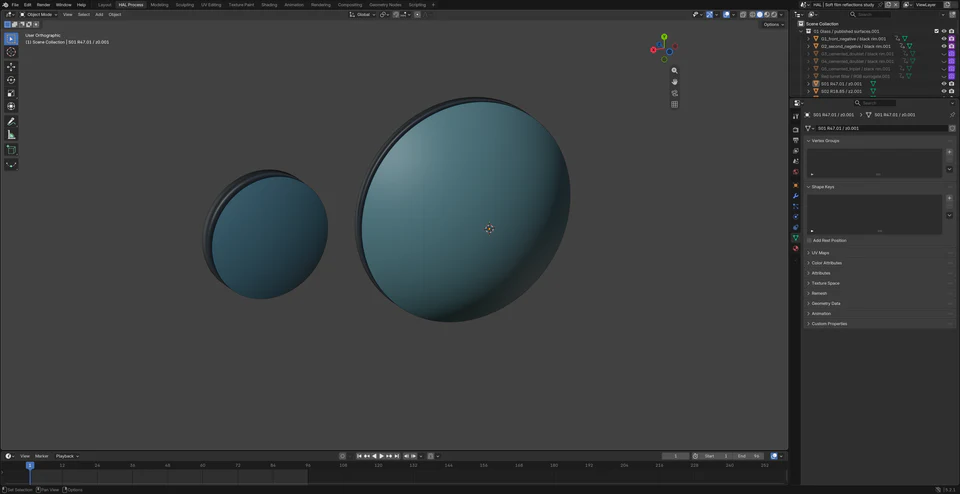 Blender viewport showing the two curved front lens elements separated for inspection